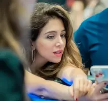 Rania Nasreddine seated playing high stakes cash game poker
