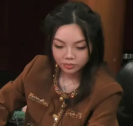 Ella seated playing high stakes poker on Hustler Casino Live