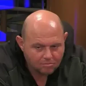 Allen seated playing mid-stakes cash game poker on the Hustler Casino Live stream.