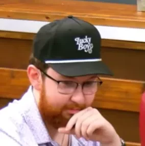 Biig D seated playing mid-stakes cash game poker on the Poker At The Lodge livestream.