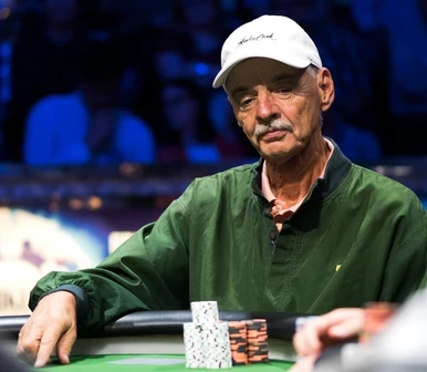 Bill Klein seated playing high stakes cash game poker on Hustler Casino Live.