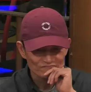 Chris seated playing mid-stakes cash game poker on the Hustler Casino Live stream.