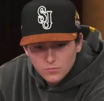 Chris seated playing mid-stakes cash game poker on the Hustler Casino Live stream.