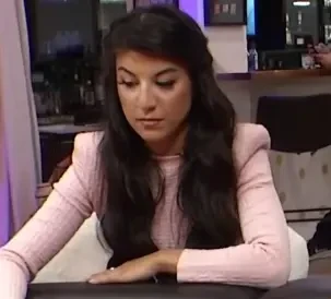 Christina Gollins aka "Baby Shark" seated playing high stakes cash game poker on livestream. 
