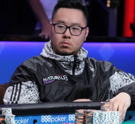 Danny Tang seated playing high stakes cash game poker on Triton Poker.