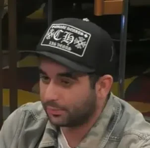 Dillon seated playing mid-stakes cash game poker on the Hustler Casino Live stream.