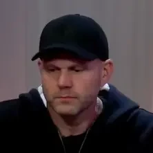 Dr. Phil seated playing high stakes cash game poker on the Venetian Poker Live stream.