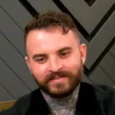 Drake seated playing mid-stakes cash game poker on the Poker At The Lodge livestream.