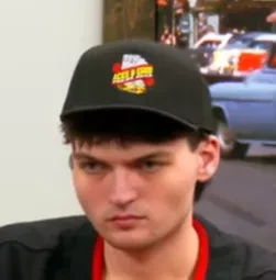 Dylan seated playing mid-stakes poker on the Poker At The Lodge livestream.