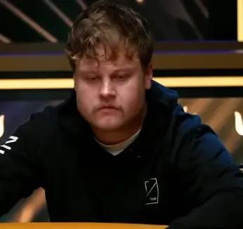 Elias Talvitie seated playing high stakes heads up cash game poker against Monarch