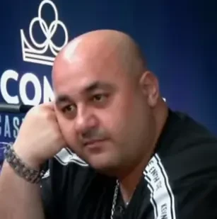 George seated playing mid-stakes cash game poker on the Bally Live Poker livestream.