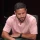 Henry Guttman seated playing high stakes cash game poker on livestream.