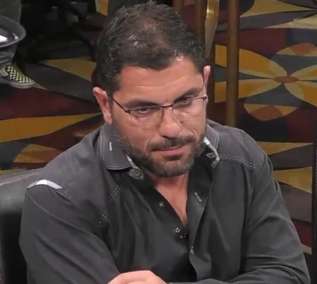 Johnny Stevens seated playing high stakes cash game poker on Hustler Casino Live. 