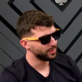 Justin seated playing low stakes cash game poker on the Poker At The Lodge livestream.