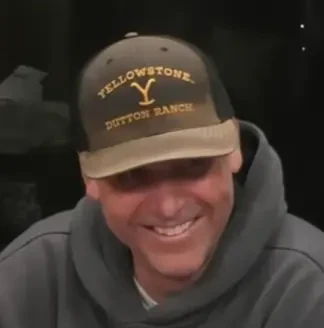 Kelly seated playing mid stakes cash game poker on the Hustler Casino Live stream.