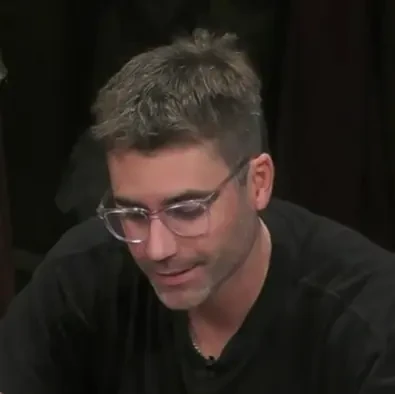 Kevin Nee seated playing mid-stakes cash game poker on the Hustler Casino Live stream.