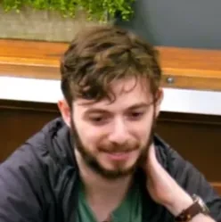 Leo seated playing mid-stakes cash game poker on the Poker At The Lodge livestream.