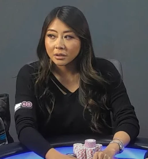 Maria Ho seated playing high stakes cash game poker on Live At The Bike.