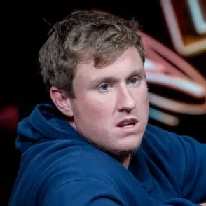 Matt Kirk seated playing a high stakes pot limit omaha cash game at PartyPokerLive.