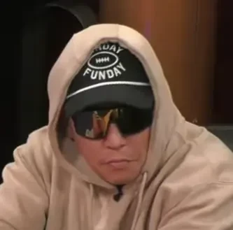 Matthew seated playing mid-stakes cash game poker on the Hustler Casino Live stream.