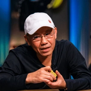 Paul Phua seated playing high stakes cash game poker at Triton Poker.