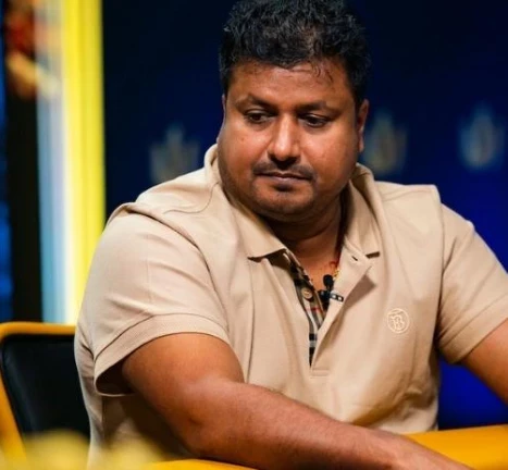 Santhosh Suvarna seated playing high stakes cash game poker at Triton Poker.