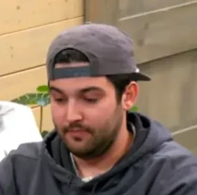 Skippy seated playing mid-stakes cash game poker on the Poker At The Lodge livestream.