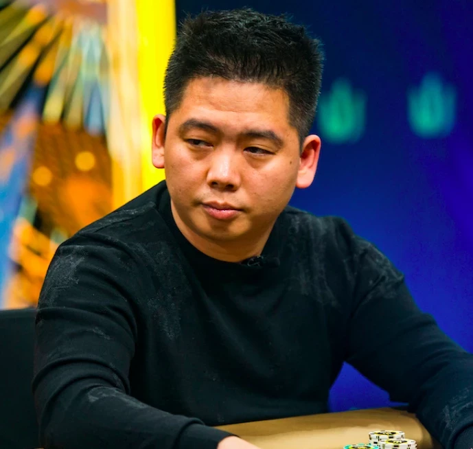 Tan Xuan seated playing high stakes cash game poker at Triton Poker.