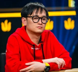 Wai Kin Yong seated playing high stakes cash game poker on Triton Poker.