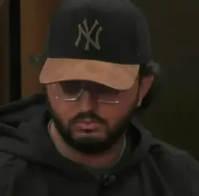 Wizbit seated playing high stakes cash game poker on the Hustler Casino Live stream.